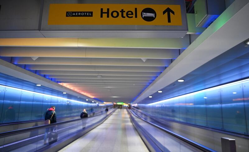 A sign showing a way to an airport hotel at Heathrow Airport in London. People arriving into Heathrow from so called 'at risk' countries will have to isolate in designated government hotels for up to ten days at their own cost.  EPA