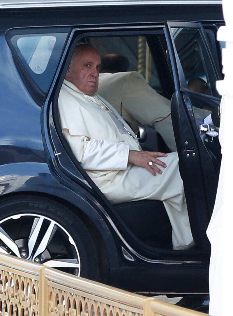 The pontiff exiting the Kia Soul. Photo: EPA