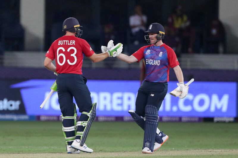 England's captain Eoin Morgan, right, and Jos Buttler after defeating West Indies in the T20 World Cup at the Dubai International Stadium on Saturday, October  23, 2021. AP