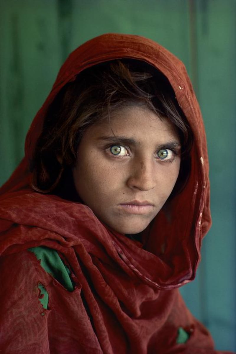 Sharbat Gula, an Afghan girl, at the Nasir Bagh refugee camp near Peshawar, Pakistan, 1984.