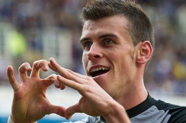 FILE - Tottenham Hotspur's Gareth Bale celebrates after scoring against Reading during their English Premier League soccer match at the Madjeski stadium, Reading, England, Sunday, Sept.  16, 2012.  (AP Photo / Tom Hevezil, File)