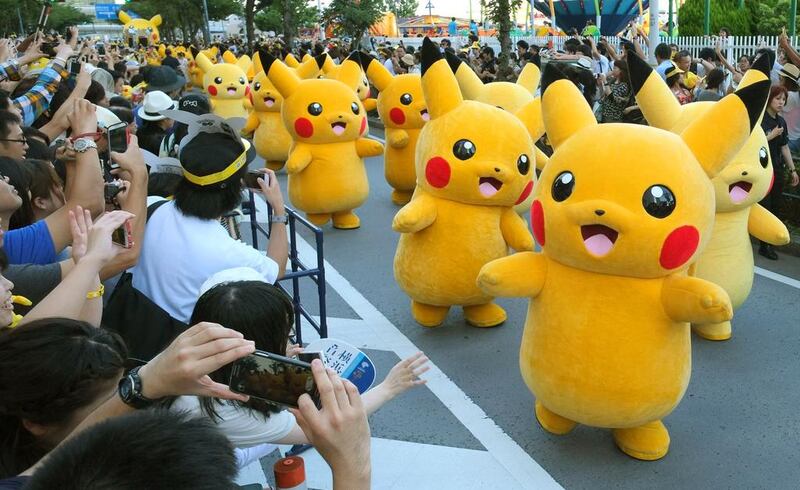 Performers dressed as Pikachu, the popular animation Pokemon series character, perform in the Pikachu parade in Yokohama. AFP
