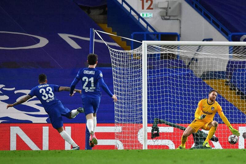 Chelsea's Brazilian-Italian defender Emerson Palmieri (L) scores his team's second goal during the UEFA Champions League round of 16 second leg football match between Chelsea and Atletico Madrid at Stamford Bridge in London on March 17, 2021. (Photo by Ben STANSALL / AFP)