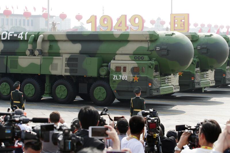 Military vehicles carrying DF-41 intercontinental ballistic missiles travel past Tiananmen Square. Reuters