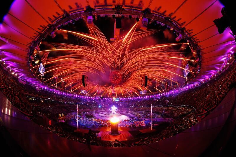 LONDON, ENGLAND - AUGUST 29:  (EDITORS NOTE: THIS IMAGE WAS CREATED WITH A FISH EYE LENS) Fireworks light up the stadium as the Paralympic Cauldron burns during the Opening Ceremony of the London 2012 Paralympics at the Olympic Stadium on August 29, 2012 in London, England.  (Photo by Mike Ehrmann/Getty Images) *** Local Caption ***  150952405.jpg