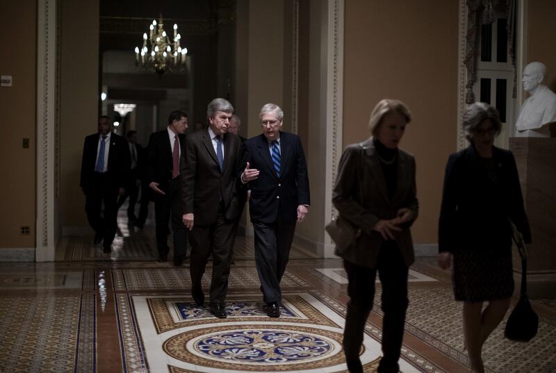 Senate Majority Leader Mitch McConnell, a Republican from Kentucky, center right, speaks with Senator Roy Blunt, a Republican from Missouri, as they head to a vote on Capitol Hill in Washington, D.C., U.S., on Monday, Jan. 28, 2019. The Senate advanced legislation on Monday that would impose new sanctions on Syria, more than a month after President Donald Trump said he would withdraw American forces from the conflict there. Photographer: Eric Thayer/Bloomberg
