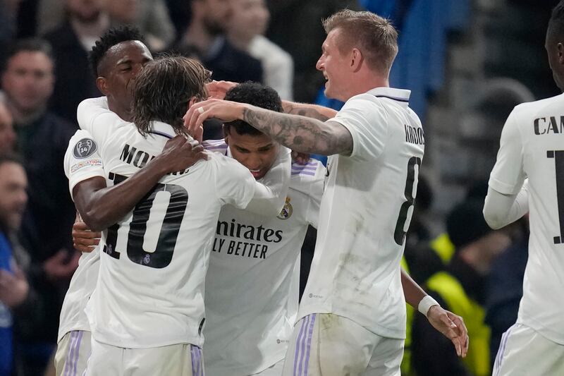 Real Madrid's players celebrates after Rodrygo, centre, scored the opening goal during. AP