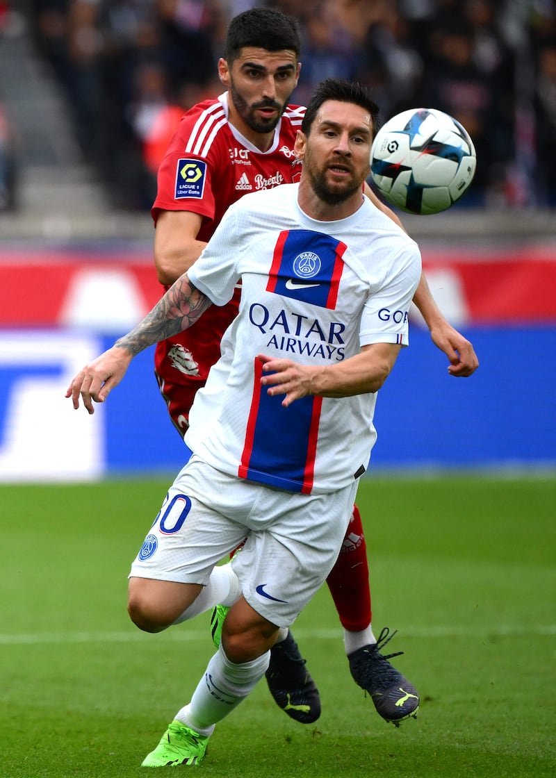 Lionel Messi battles for the ball with Brest's French midfielder Pierre Lees-Melou. AFP