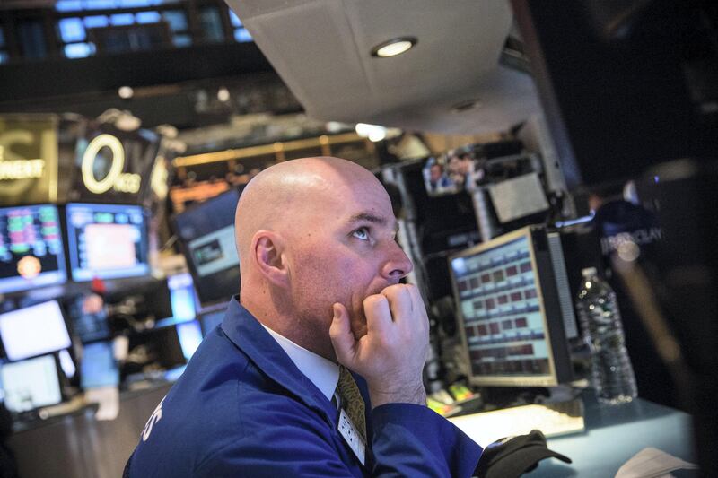 NEW YORK, NY - MARCH 19:  A trader on the floor of the New York Stock Exchange reacts to an announcement from the Federal Reserve during the afternoon of March 19, 2014 in New York City. The Federal Reserve announced that it would cut bond purchases by $10 Billion.  (Photo by Andrew Burton/Getty Images)