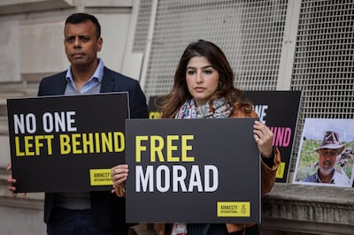 Roxanne Tahbaz, daughter of Morad Tahbaz, and Sacha Deshmukh, of Amnesty, campaign outside the Foreign Office in London. Getty Images