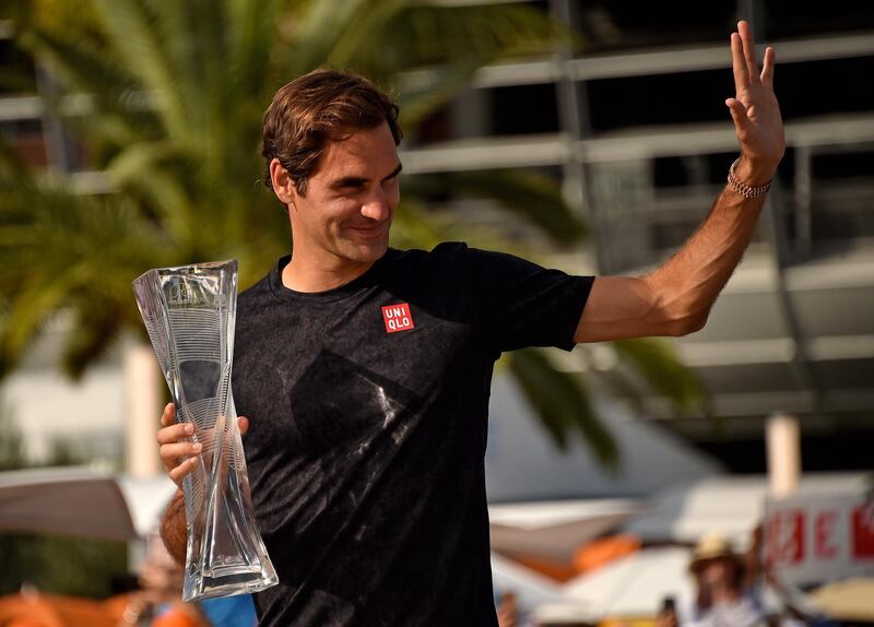 Mar 31, 2019; Miami Gardens, FL, USA; Roger Federer of Switzerland poses with the trophy after defeating John Isner of the United States (not pictured) during the men’s finals at the Miami Open at Miami Open Tennis Complex. Mandatory Credit: Steve Mitchell-USA TODAY Sports