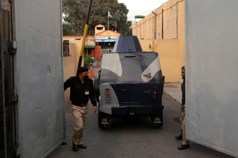 epa09086134 Pakistani police closes the gate as an armoured vehicle enters the district Jail lahore during the special court setup for the trial of prime suspects in motorway gang rape case, in Lahore, Pakistan, 20 March 2021. A prosecutor said on 20 March that an anti-terrorism court has awarded death penalty and 14 year jail terms to two men held for motorway gang rape of a woman in front of her children last year in eastern Punjab province.  EPA/RAHAT DAR
