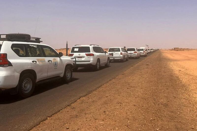 A convoy leaving Khartoum advances on a road towards Port Sudan as people flee the Sudanese capital.  AFP