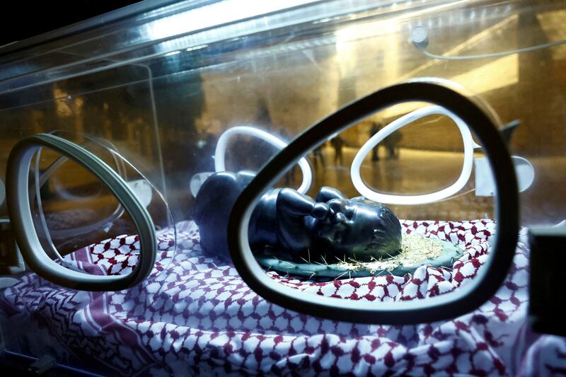 An installation by Rana Bishara shows a figure of Baby Jesus, made by Sana Fara Bishara, inside an incubator in front of the Church of the Nativity in the occupied West Bank. Reuters