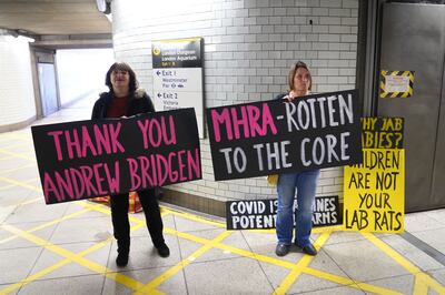 Protesters support MP Andrew Bridgen at Westminster underground station in London. PA
