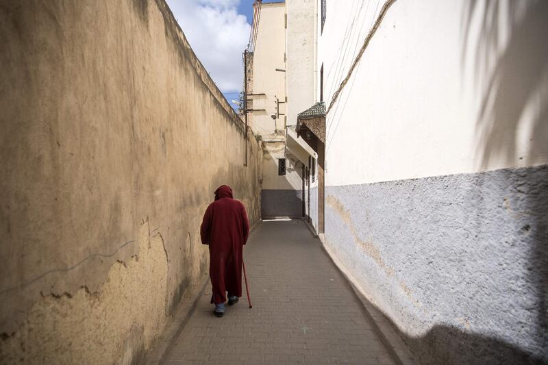 A man walks in the 9th century walled medina in the ancient Moroccan city of Fez on April 11, 2019. AFP
