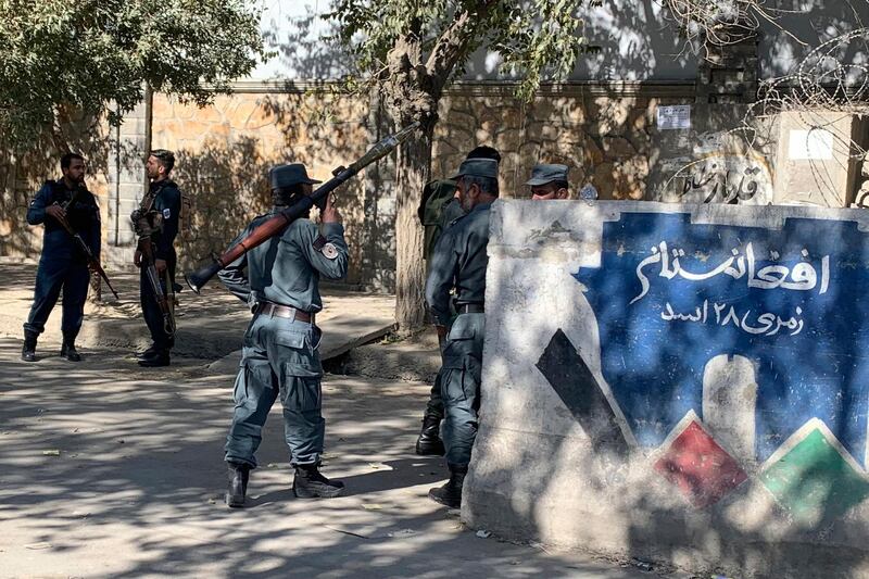 Afghan police arrive at the site of an attack at Kabul University in Kabul, Afghanistan, Monday, Nov. 2, 2020. Gunfire erupted at the university in the Afghan capital early Monday and police have surrounded the sprawling campus, authorities said. (AP Photo/Rahmat Gul)