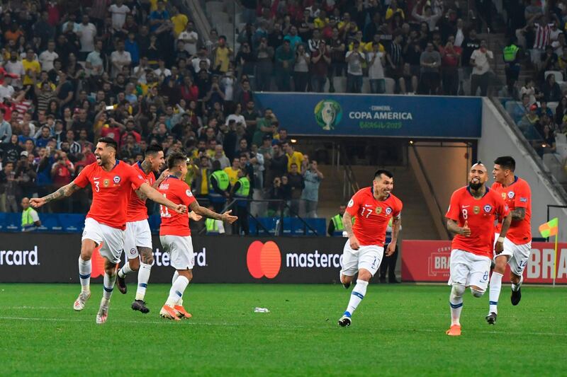 Chile players celebrate their penalty shootout win over Colombia. AFP