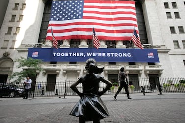 The Fearless Girl outside the New York Stock Exchange. As Covid-19 vaccine success triggers hopes of a post-pandemic recovery and investor confidence rebounds, the dollar is falling in value. AP