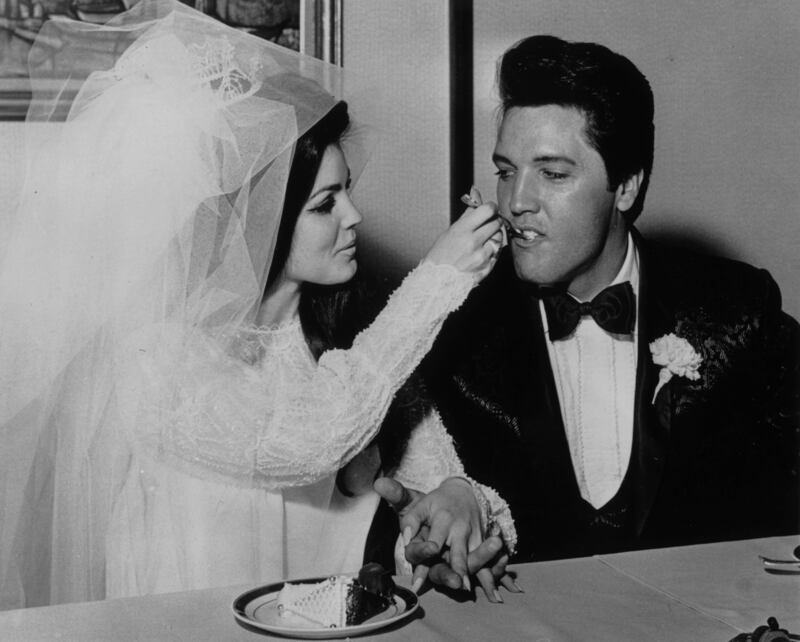 Priscilla Presley feeds Elvis wedding cake at the Aladdin Hotel, Las Vegas, in 1967