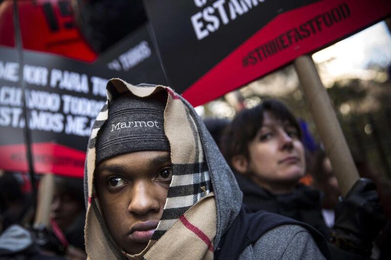 Protesters march through the streets demanding a raise on the minimum wage to $15 per hour on December 4, 2014 in New York, United States. The movement, driven largely by fast food workers, has risen in prominence in the past year; the protests were also joined by demonstrators angry at the Grand jury verdict to not indict the police officer who killed Eric Garner in July, 2014.  Andrew Burton / Getty Images / AFP