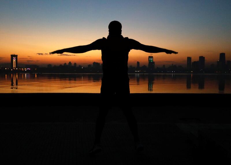 A man exercises in the early morning along the Arabian Sea in Mumbai, India.