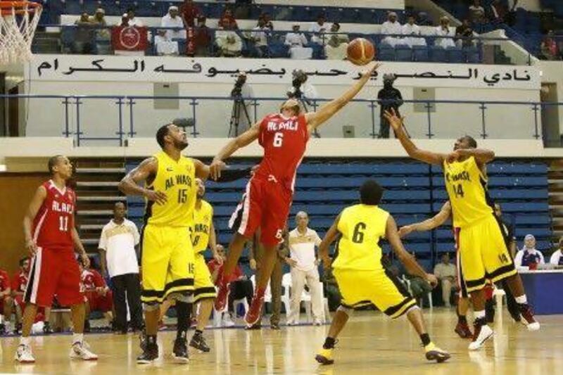 Al Ahli, in red, win ugly to beat Al Wasl for President's Cup basketball title. Mike Young / The National