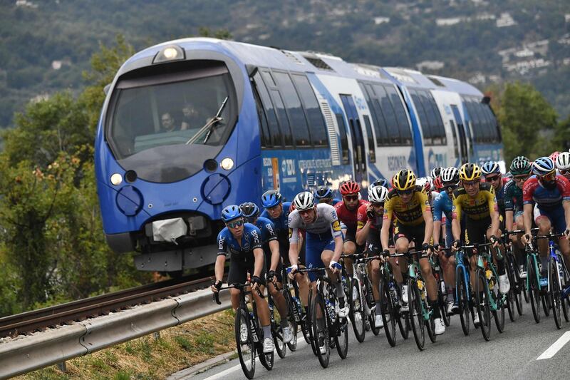 The peloton is flanked by a train during Stage 1 of the Tour de France on Saturday, August 29. AFP