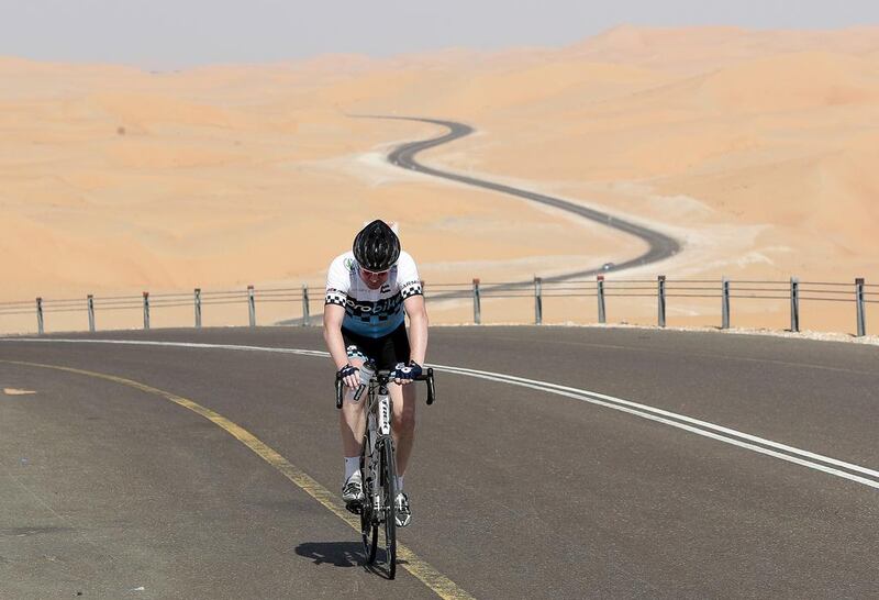 Entrants in the Liwa Cycle Challenge endure a gruelling 117km race but also beautiful scenery amid the desert. Jeffrey E Biteng / The National 