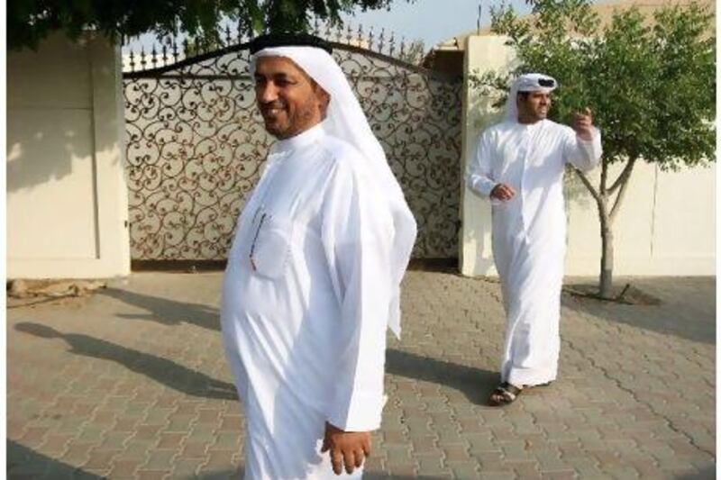 Ghareeb Ahmed Al Saridi, left, is an FNC candidate and his campaign is overseen by a former member, Dr Sultan Al Moazen, right.
