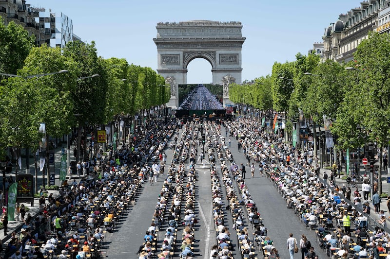 An attempt to break the record for the World’s Biggest Dictation exercise on the Champs-Elysees, Paris. AFP