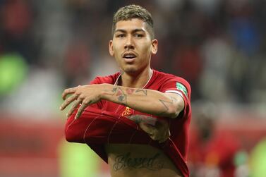 Liverpool's Brazilian midfielder Roberto Firmino celebrates his winning goal at the Fifa  Club World Cup semi-final match against Mexico's Monterrey at the Khalifa International Stadium in Doha. AFP