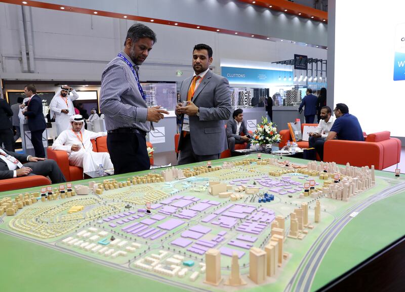 Dubai, United Arab Emirates - September 11th, 2017: Visitors at the model of Dubai silicon oasis at the 16th addition of Cityscape Global. Monday, September 11th, 2017 at World Trade centre, Dubai. 