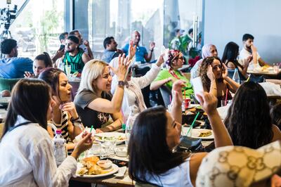 People in a cafe in Tunis watch Ons Jabeur's match against Marketa Vondrousova at Wimbledon on Saturday. AP