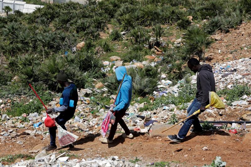 African migrants walk back home, during a lockdown to contain the spread of the coronavirus disease (COVID-19), at Hay el Farah on the outskirts of Rabat, Morocco, April 3, 2020. REUTERS/Youssef Boudlal