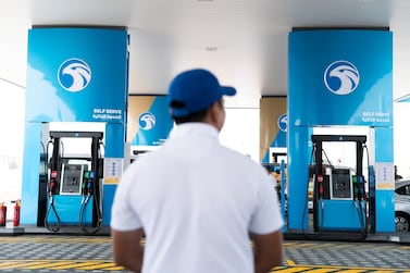 An attendant is pictured at one of Adnoc Distribution's service stations. Brand Finance said Adnoc's brand value had grown in value by 29 per cent last year to $11.39bn. Reem Mohammed/The National