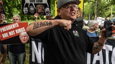 A man yells in front of where protesters against former US president Donald Trump gather outside of the Crotona Park rally venue on May 23 in the Bronx borough of New York City. AFP