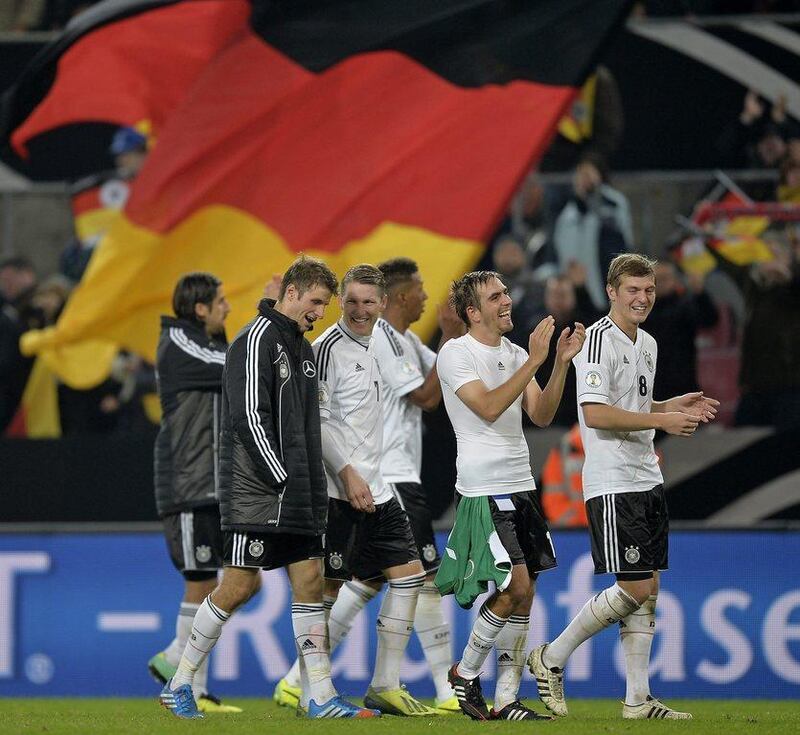 Germany 3-0 Ireland. The Germans found goals from Sami Khedira, Andre Schurrle and Mesut Ozil to wrap up qualification. Martin Meissner / AP