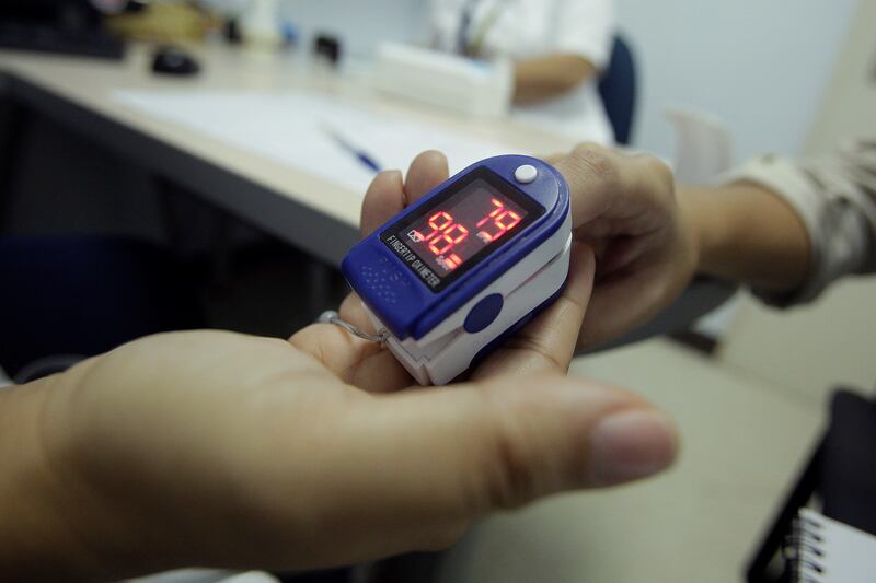 Dr Habib advised patients with chronic health problems to buy a pulse oximeter to monitor their blood oxygen levels, an important signal that could help diagnose an infection from afar.  EPA