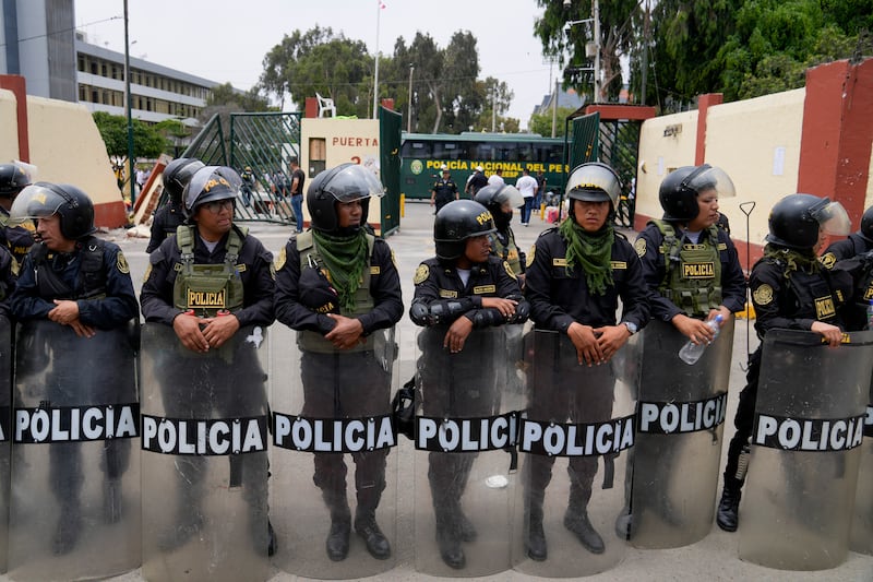 Police guard the San Marcos University in Lima after evicting protesters seeking the resignation of President Dina Boluarte. AP