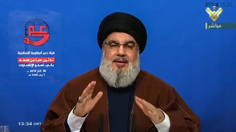 epa07422795 A TV grab handout photo from Hezbollah's al-Manar TV shows Hezbollah Secretary-General Sayeed Hassan Nasrallah as he delivers a speech on a big screen during a rally to mark the 30th anniversary of the establishment of the Islamic Resistance Support Association in southern suburb of Beirut, Lebanon, 08 March 2019.  EPA/AL-MANAR TV GRAB HANDOUT  HANDOUT EDITORIAL USE ONLY/NO SALES
