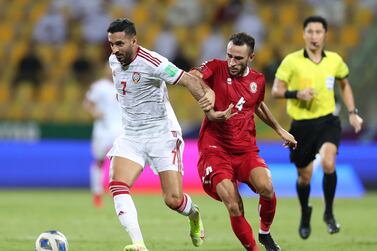 Ali Mabkhout of the UAE battles with Abbas Assi of Lebanon during the game between the UAE and Lebanon in the 3rd round of World cup qualifiers at the Zabeel Stadium in Dubai.