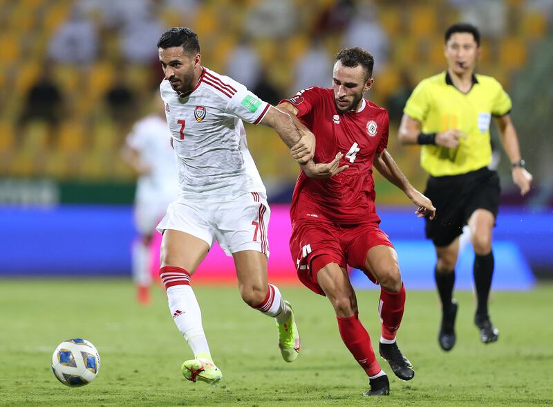 UAE's Ali Mabkhout battles with Abbas Assi of Lebanon during their World Cup 2022 qualifier at the Zabeel Stadium in Dubai on Thursday, September 2, 2021. Chris Whiteoak / The National.