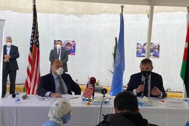 Henry Wooster, US ambassador to Jordan, left, and UNRWA Commissioner Philippe Lazzarini address a press conference in Baqaa refugee camp in Jordan, following the resumption of US aid to the UN Palestinian relief agency. Amy McConaghy / The National