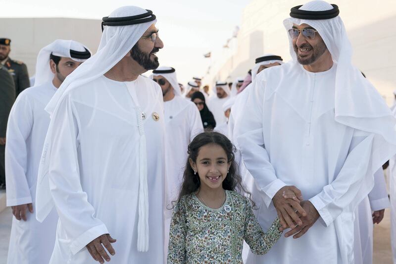 ABU DHABI, UNITED ARAB EMIRATES - November 30, 2017: HH Sheikh Mohamed bin Rashid Al Maktoum, Vice-President, Prime Minister of the UAE, Ruler of Dubai and Minister of Defence (L), HH Sheikha Fatima bint Mohamed bin Hamad bin Tahnoon Al Nahyan (C) and HH Sheikh Mohamed bin Zayed Al Nahyan, Crown Prince of Abu Dhabi and Deputy Supreme Commander of the UAE Armed Forces (R), attend a Commemoration Day ceremony at Wahat Al Karama, a memorial dedicated to the memory of UAE’s National Heroes in honour of their sacrifice and in recognition of their heroism.

( Omar Al Askar for The Crown Prince Court - Abu Dhabi  )
---