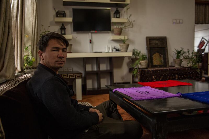 Abdullah Mahmoodi, owner of the highland hotel sits in the guesthouse's living room. All international tours have been cancelled. 