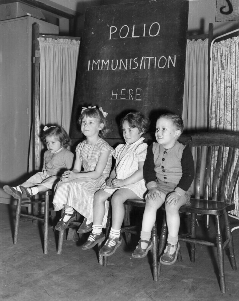 Four young children wait for injections against polio at the Fairfield Welfare Clinic in Wandsworth, south London, in 1956.
