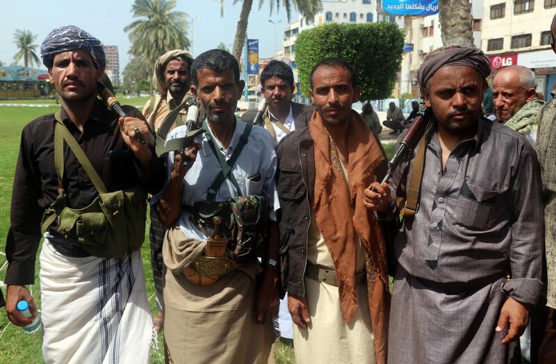 Shiite Huthi rebels are seen during a gathering to mobilise more fighters to the battlefront to fight pro-government forces, in the Red Sea port city of Hodeidah on June 18, 2018. The UAE, a key player in the coalition battling Huthi rebels in Yemen, warned the insurgents to withdraw unconditionally from the flashpoint port city of Hodeida, after UN peace efforts fizzled. / AFP / ABDO HYDER

