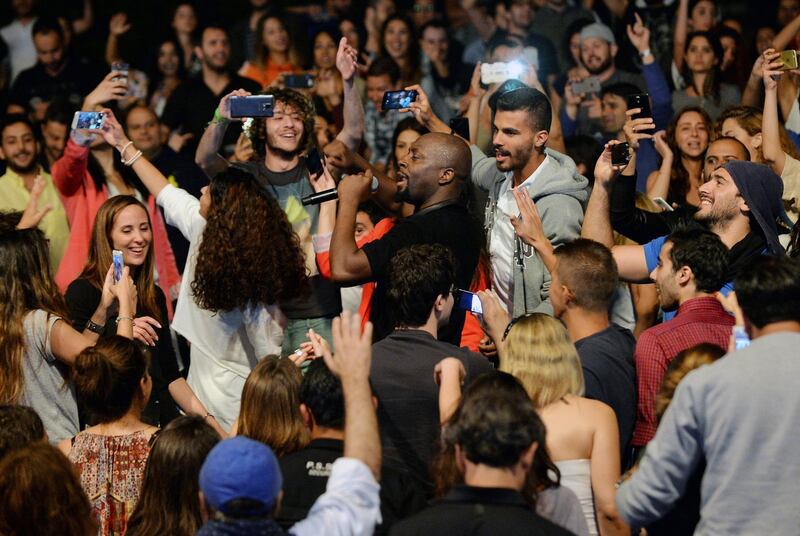 epa04783486 US singer Wyclef Jean performs oin the crowd at the opening of The Summer Misk Festival 2015 east Beirut, Lebanon, 04 June 2015. The Summer Misk Festival 2015 runs from 04 to 07 June.  EPA/WAEL HAMZEH