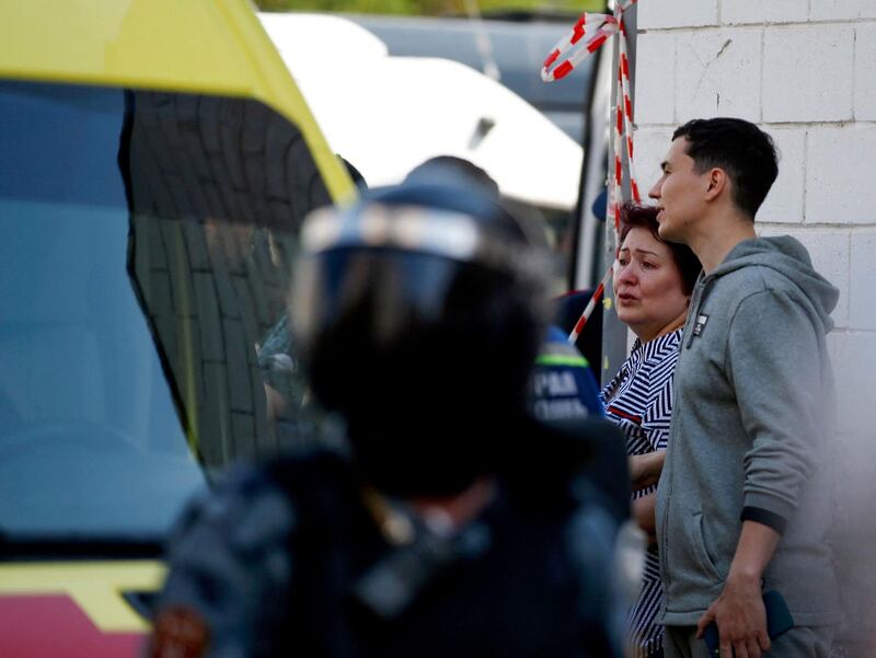 People gather at the scene of a shooting at School No. 175 in Kazan. AFP